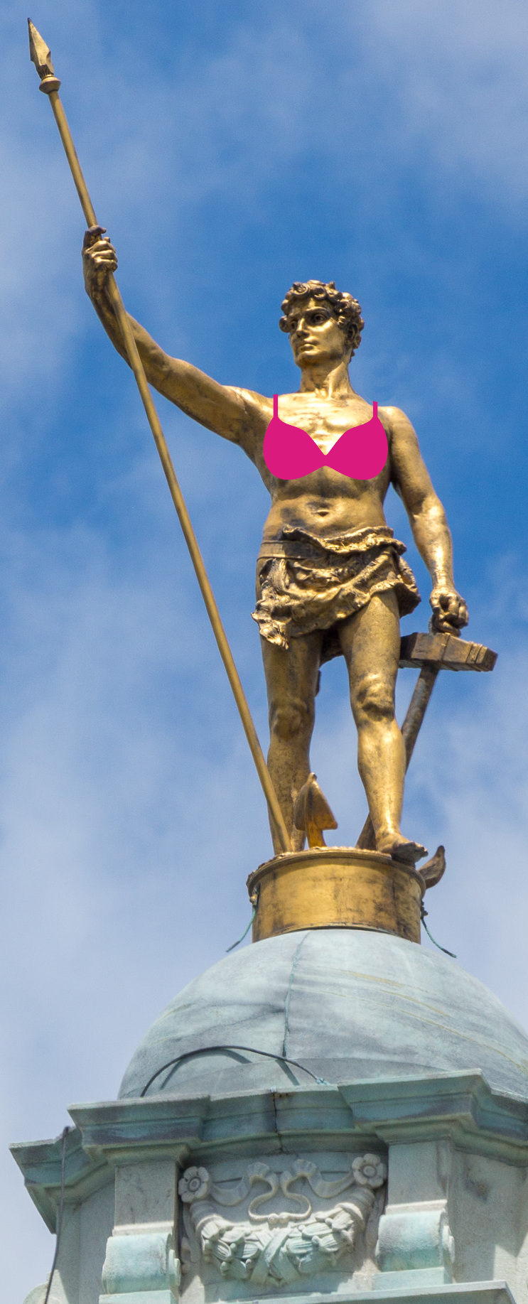 Promotional image for THE ASSEMBLYWOMEN depicting the figure on top of the Statehouse wearing a bra.